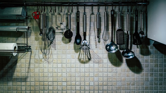 a rack full of kitchen utensils